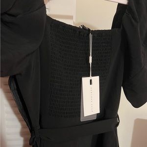 Black romper size M NWT